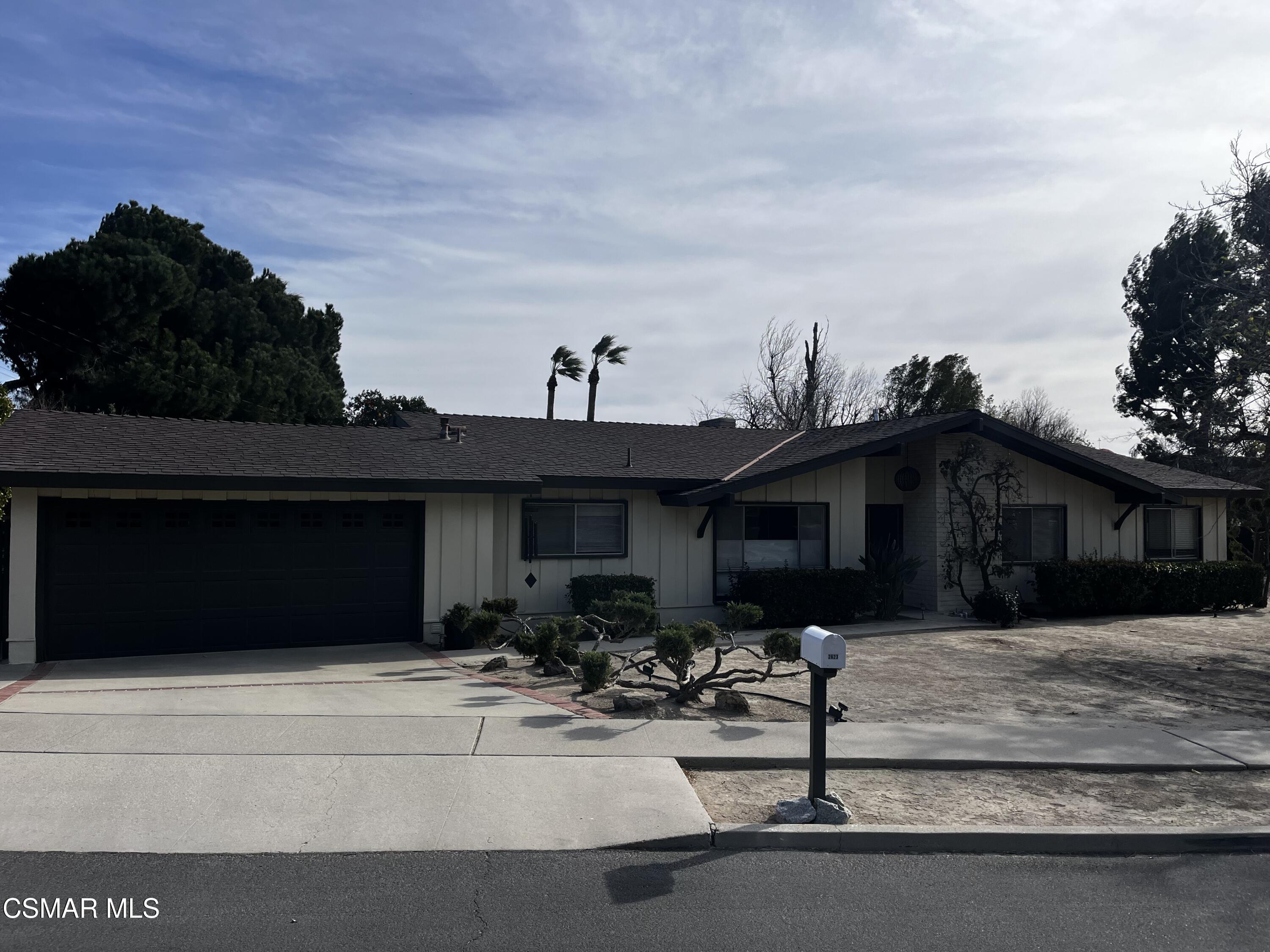 2623 Avenida Simi Simi Valley, CA 93065 - Photo 2 of 24 a front view of a house with a yard