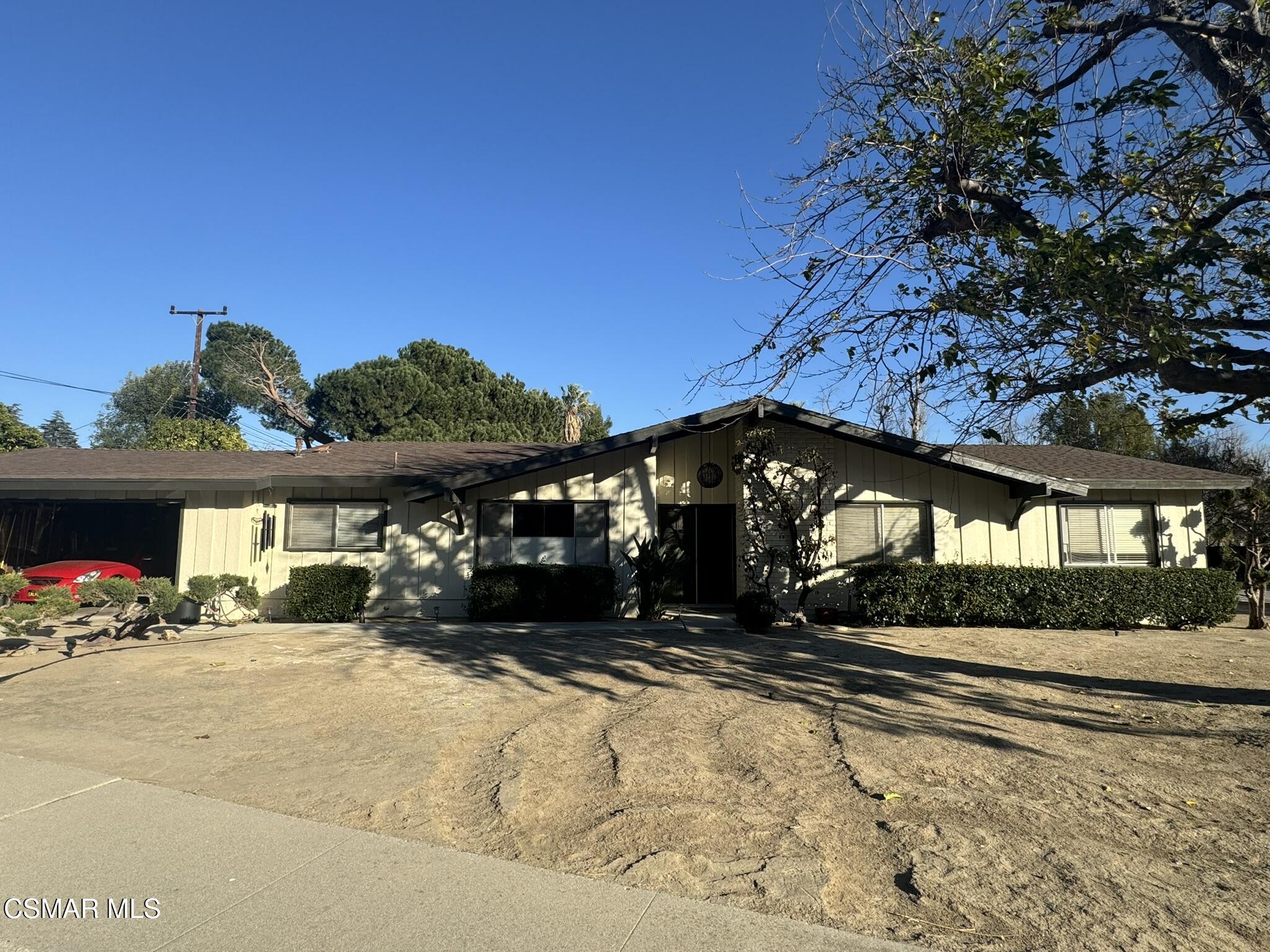 2623 Avenida Simi Simi Valley, CA 93065 - Photo 4 of 24 a front view of a house with a yard