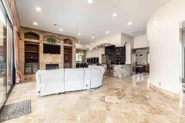 a kitchen with granite countertop a stove sink and cabinets