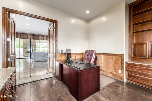 a workspace with furniture window and a ceiling fan