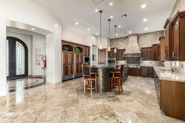 a work room with furniture and a chandelier