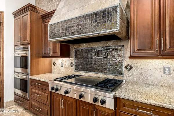 a utility room with sink dryer and washer
