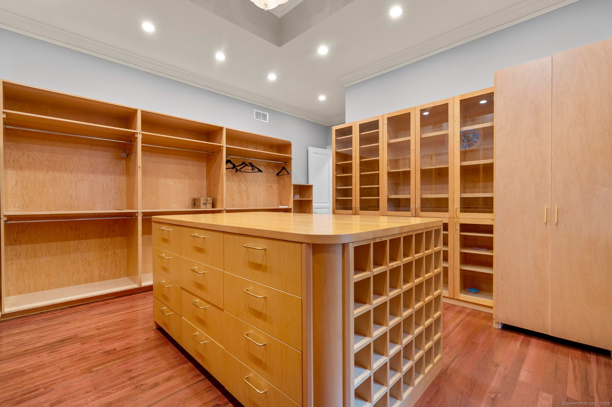 23 Robkins Road Avon, CT 06001 - Photo 22 of 40 a view of walk in closet with wooden floor and windows