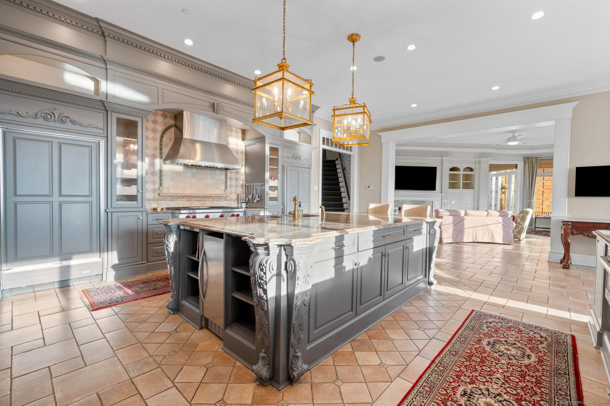 23 Robkins Road Avon, CT 06001 - Photo 26 of 40 a large kitchen with kitchen island granite countertop a large counter top and a view of living room