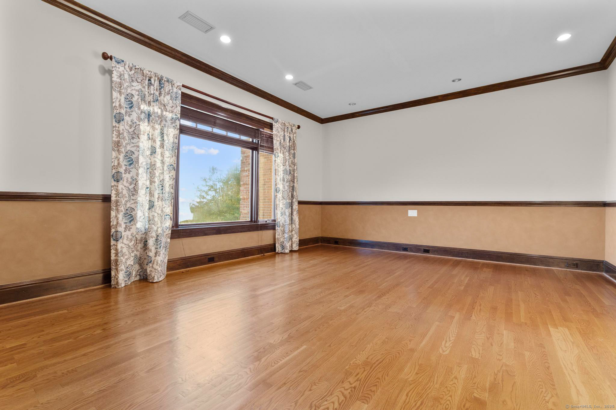 23 Robkins Road Avon, CT 06001 - Photo 26 of 40 a view of an empty room with wooden floor and a window