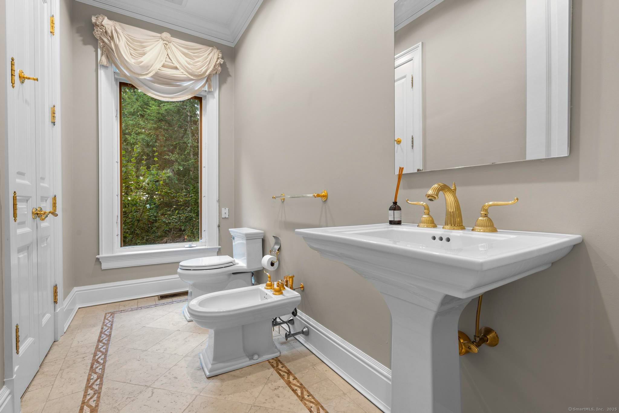 23 Robkins Road Avon, CT 06001 - Photo 27 of 40 a bathroom with a sink a toilet and a window