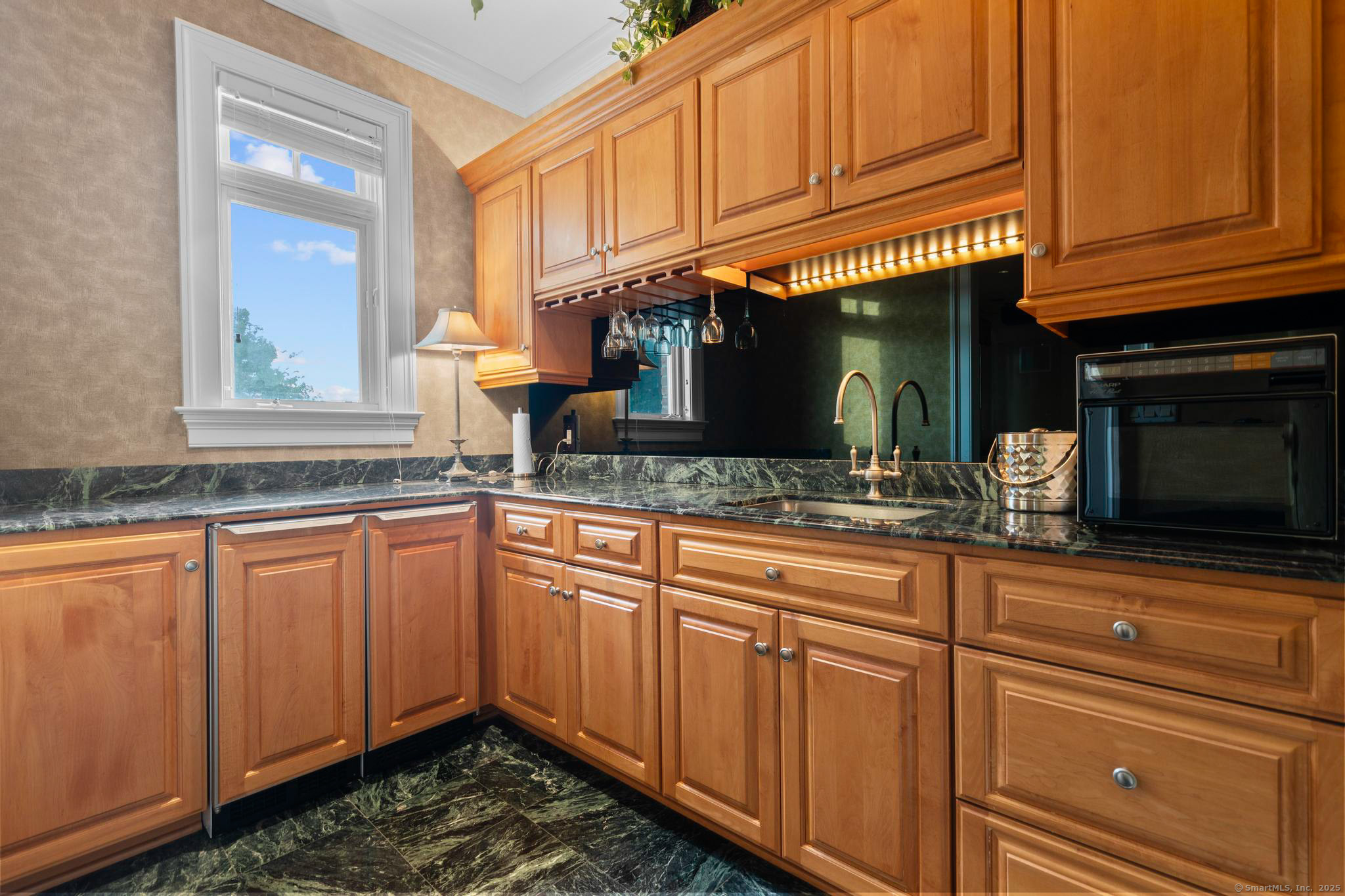 23 Robkins Road Avon, CT 06001 - Photo 29 of 40 a kitchen with stainless steel appliances granite countertop cabinets and window