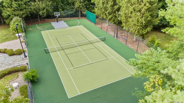 a swimming pool with outdoor seating and yard