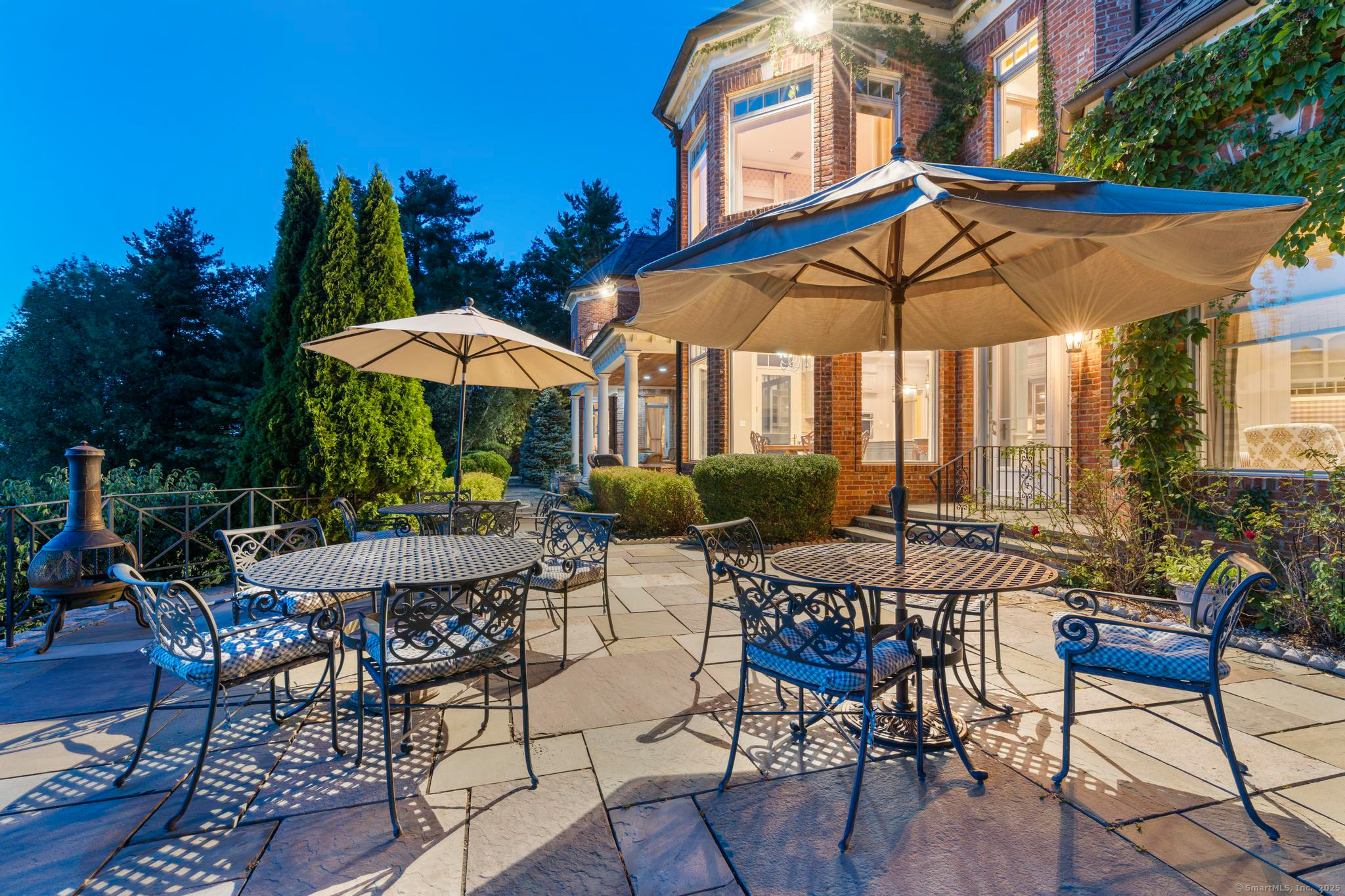 23 Robkins Road Avon, CT 06001 - Photo 40 of 40 a view of patio with chairs and table under an umbrella