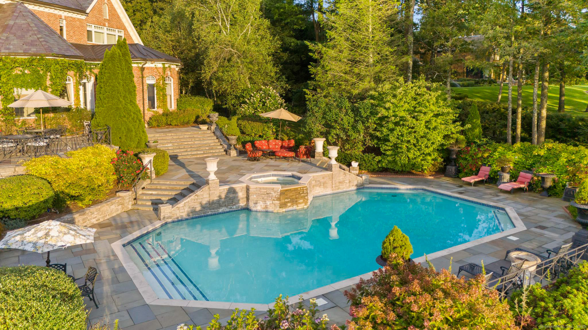 23 Robkins Road Avon, CT 06001 - Photo 6 of 40 a view of a swimming pool with a patio