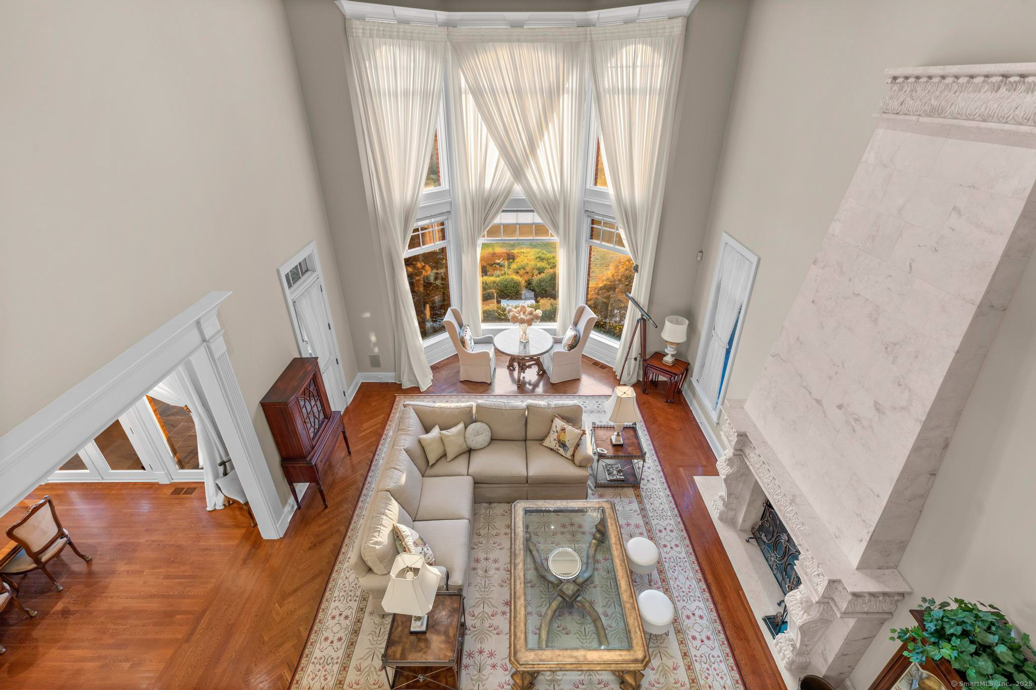 23 Robkins Road Avon, CT 06001 - Photo 10 of 40 a living room with furniture and a large window