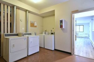 6060 North Ridge Avenue, Unit 1A Chicago, IL 60660 - Photo 19 of 25 a view of a hallway with washer and dryer