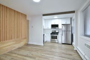 6060 North Ridge Avenue, Unit 1A Chicago, IL 60660 - Photo 8 of 25 a kitchen with a refrigerator and a stove top oven