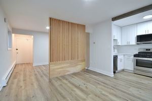 6060 North Ridge Avenue, Unit 1A Chicago, IL 60660 - Photo 10 of 25 a view of kitchen with wooden floor electronic appliances and window