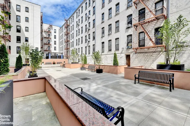 a bedroom with a bed and windows