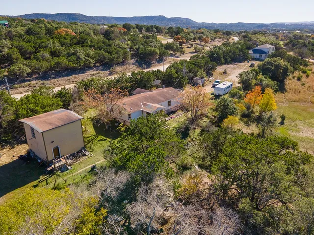 an aerial view of residential house with parking space