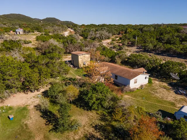 an aerial view of house with yard