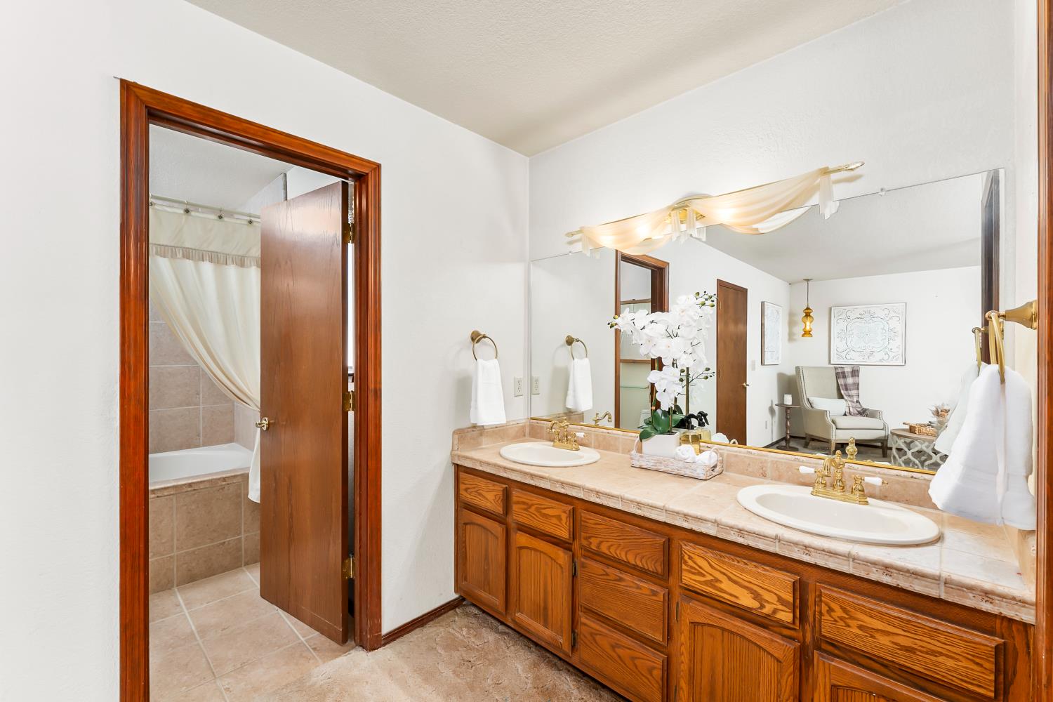 3708 Millbrae Road Cameron Park, CA 95682 - Photo 18 of 48 a bathroom with a double vanity sink and a mirror