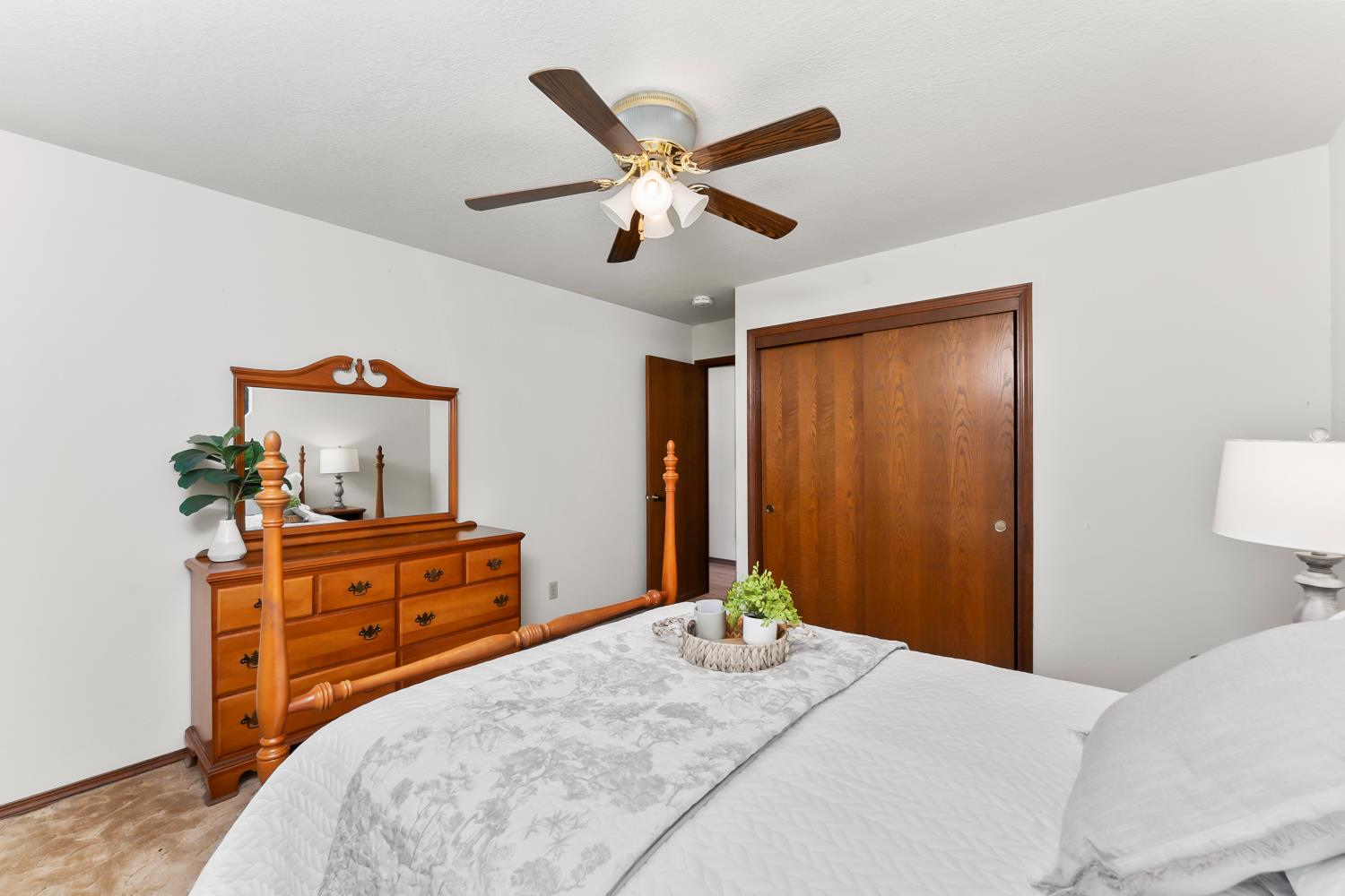 3708 Millbrae Road Cameron Park, CA 95682 - Photo 21 of 48 a bedroom with a bed and a chandelier