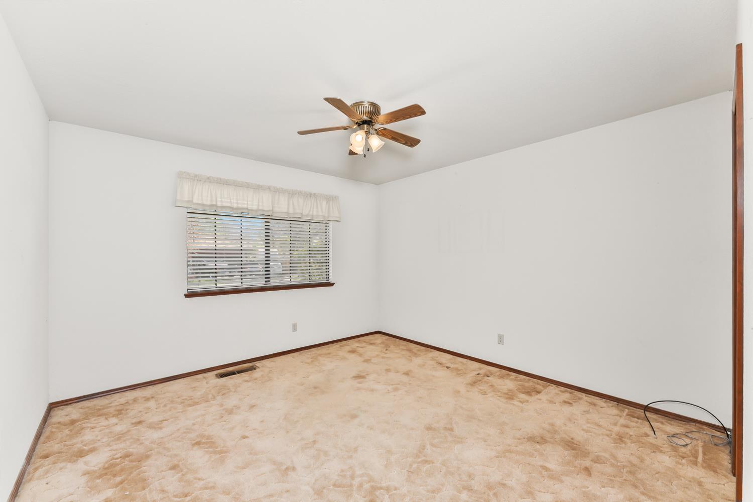 3708 Millbrae Road Cameron Park, CA 95682 - Photo 22 of 48 an empty room with a window and a ceiling fan