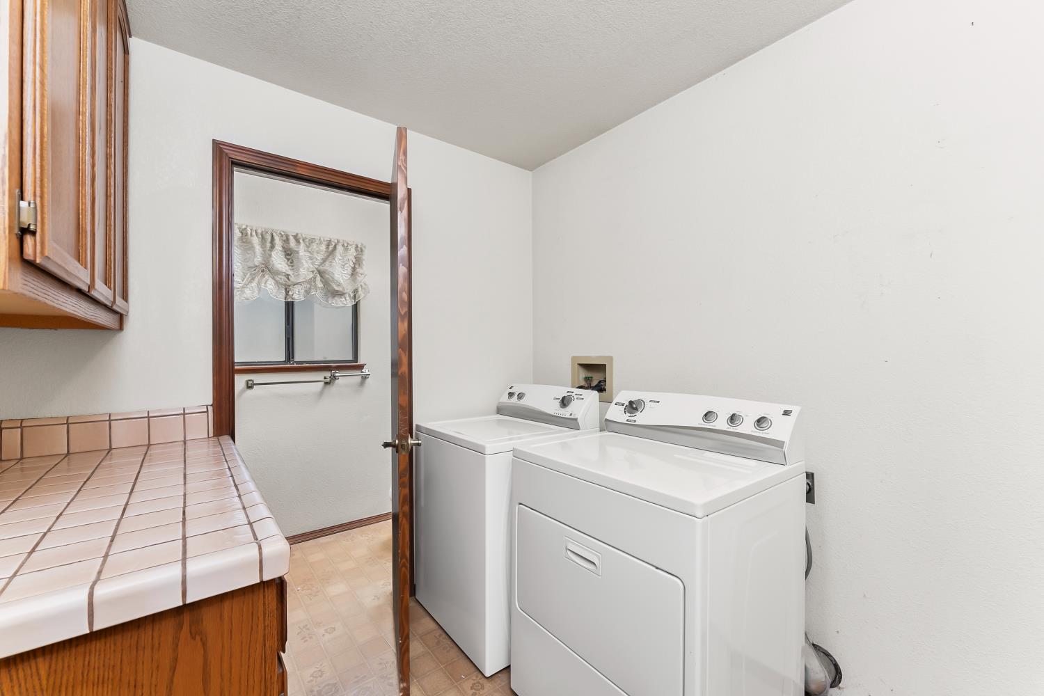 3708 Millbrae Road Cameron Park, CA 95682 - Photo 25 of 48 a utility room with dryer and washer