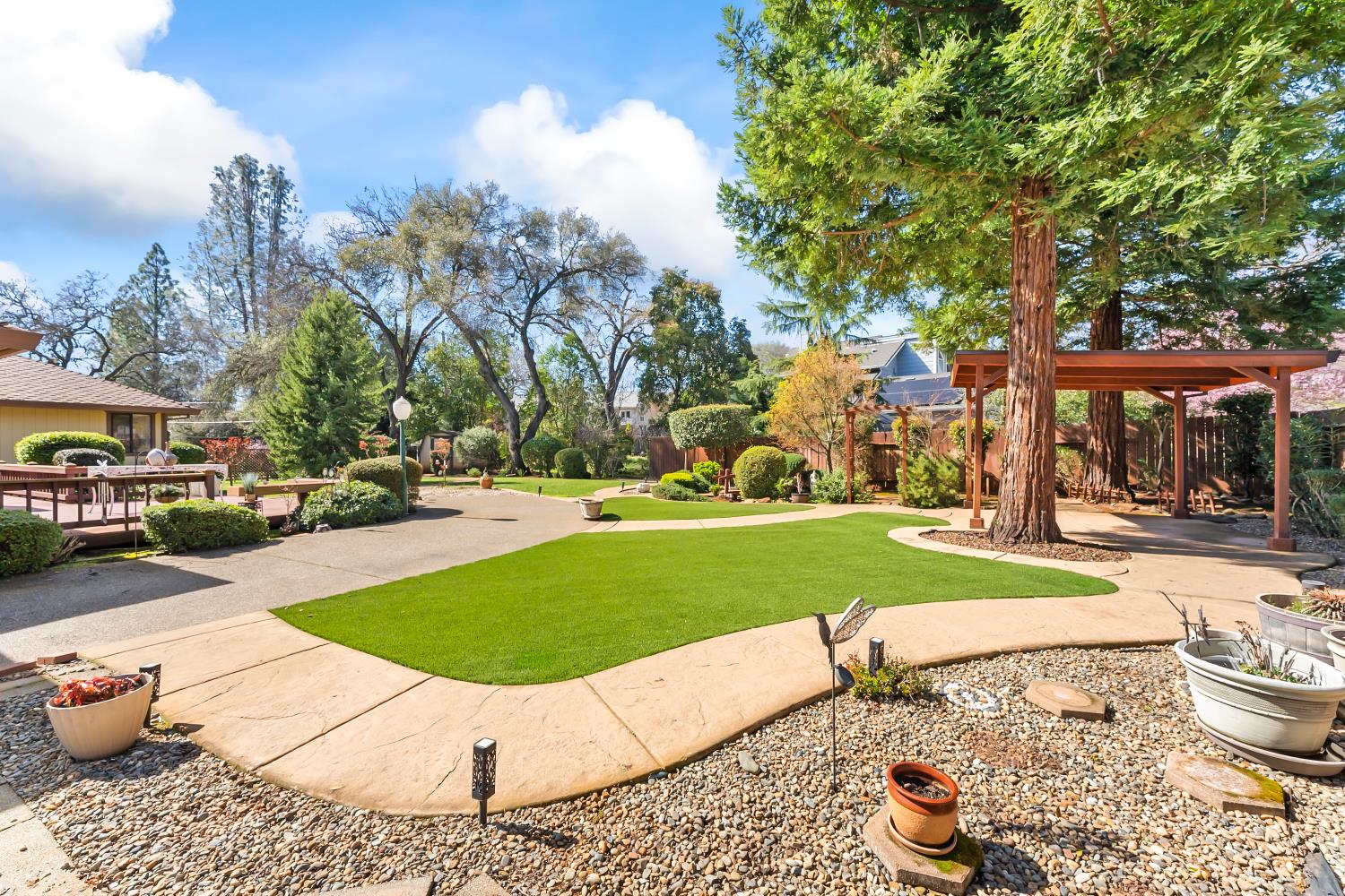 3708 Millbrae Road Cameron Park, CA 95682 - Photo 37 of 48 a view of a house with a swimming pool and a fire pit