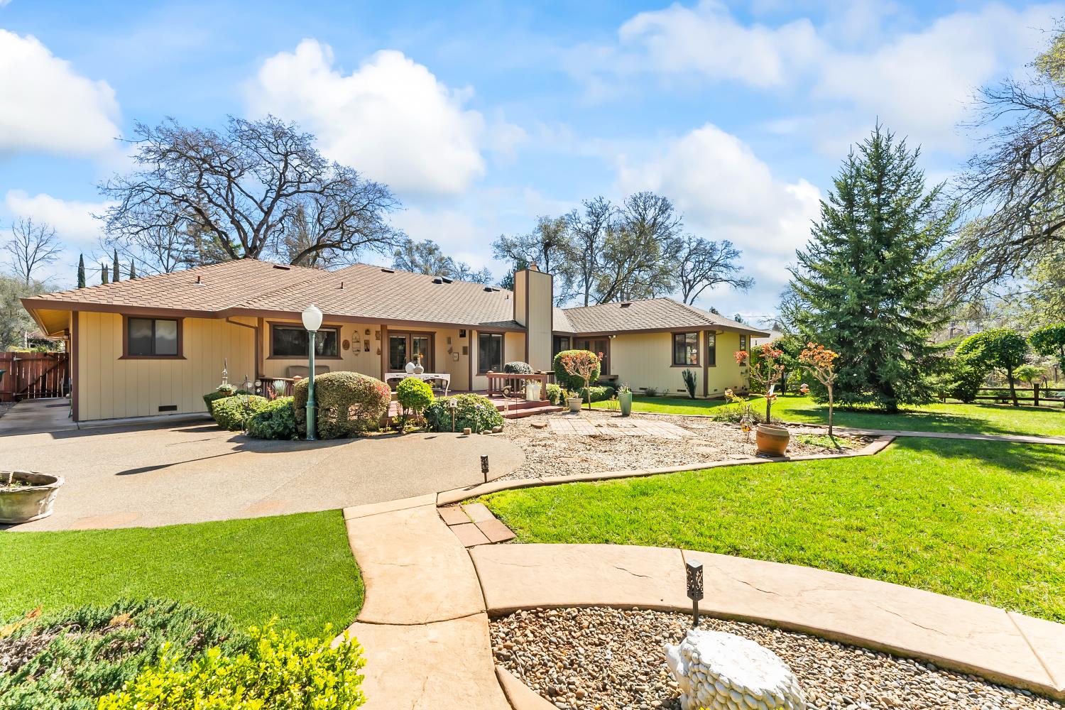 3708 Millbrae Road Cameron Park, CA 95682 - Photo 41 of 48 a front view of a house with garden and porch