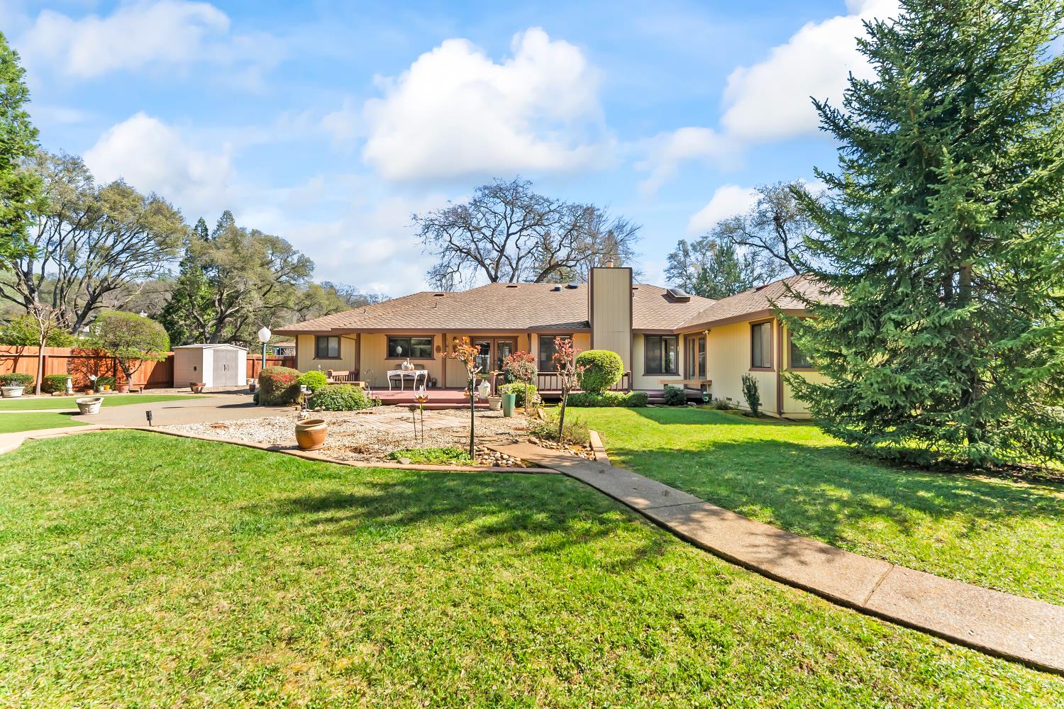 3708 Millbrae Road Cameron Park, CA 95682 - Photo 42 of 48 a front view of a house with garden and porch