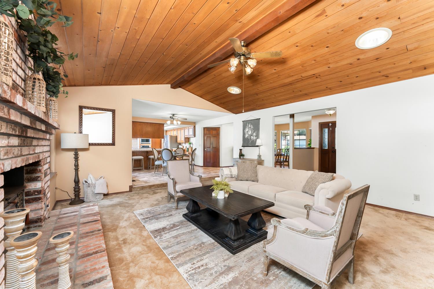 3708 Millbrae Road Cameron Park, CA 95682 - Photo 7 of 48 a living room with furniture a flat screen tv and a fireplace