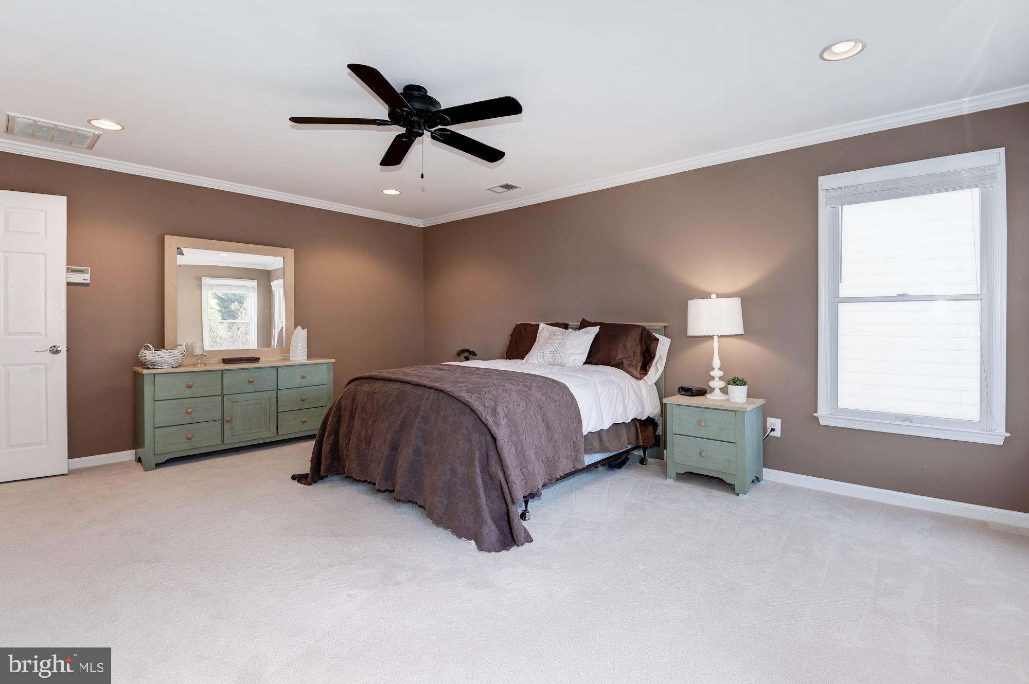 1326 Murray Downs Way Reston, VA 20194 - Photo 25 of 41 a bedroom with a bed dresser and a window