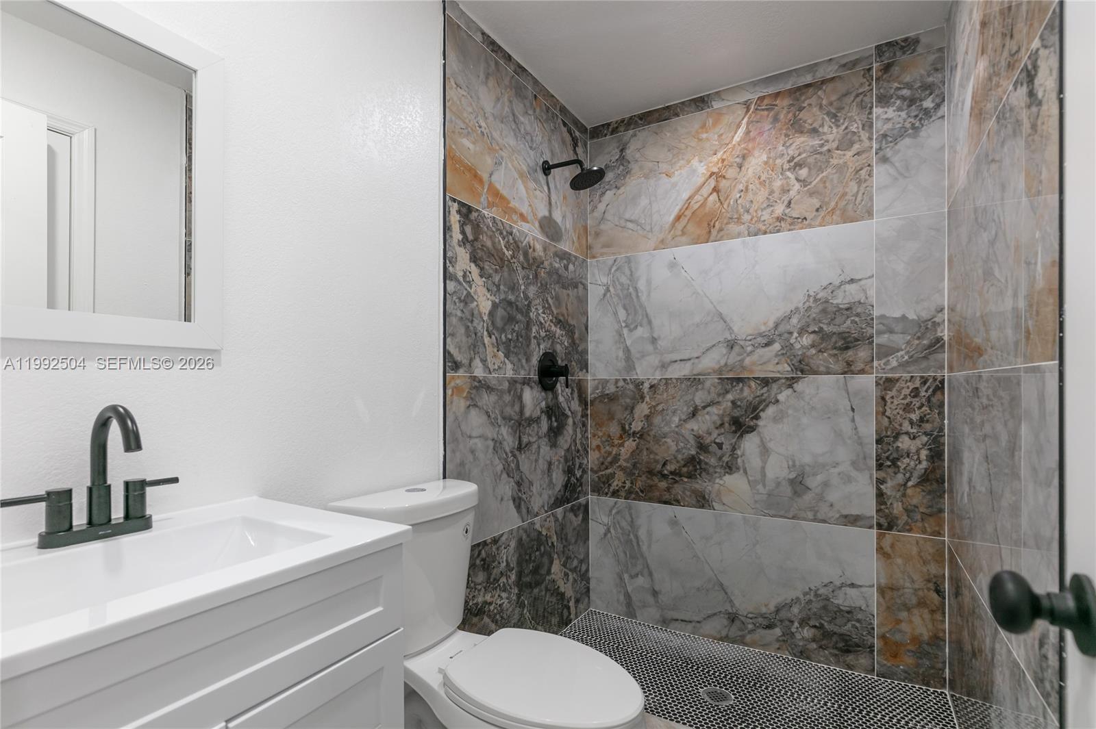 6125 Southwest 40th Court Miramar, FL 33023 - Photo 19 of 43 a bathroom with a sink toilet and shower