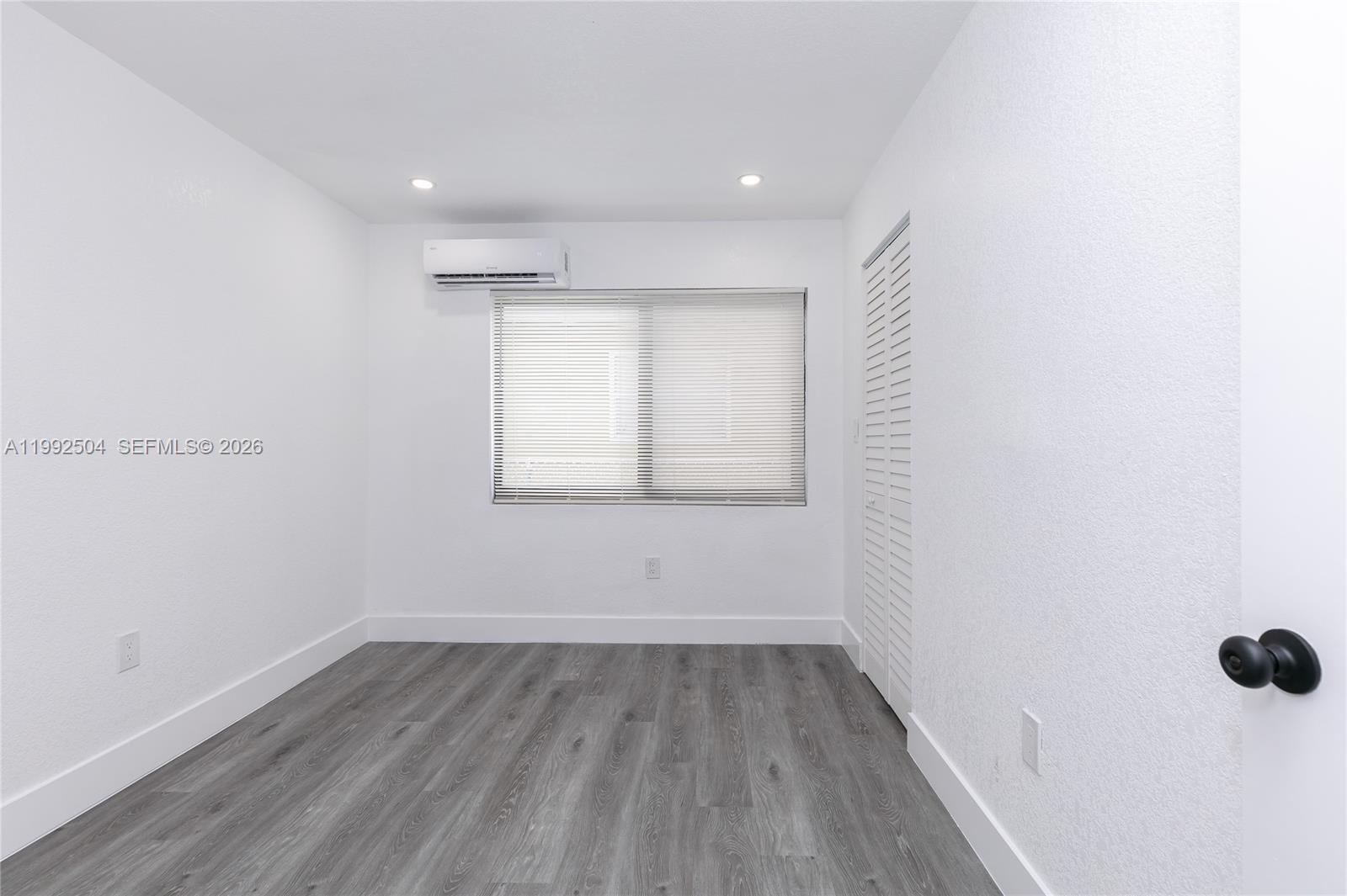 6125 Southwest 40th Court Miramar, FL 33023 - Photo 28 of 43 a view of a room with wooden floor and window