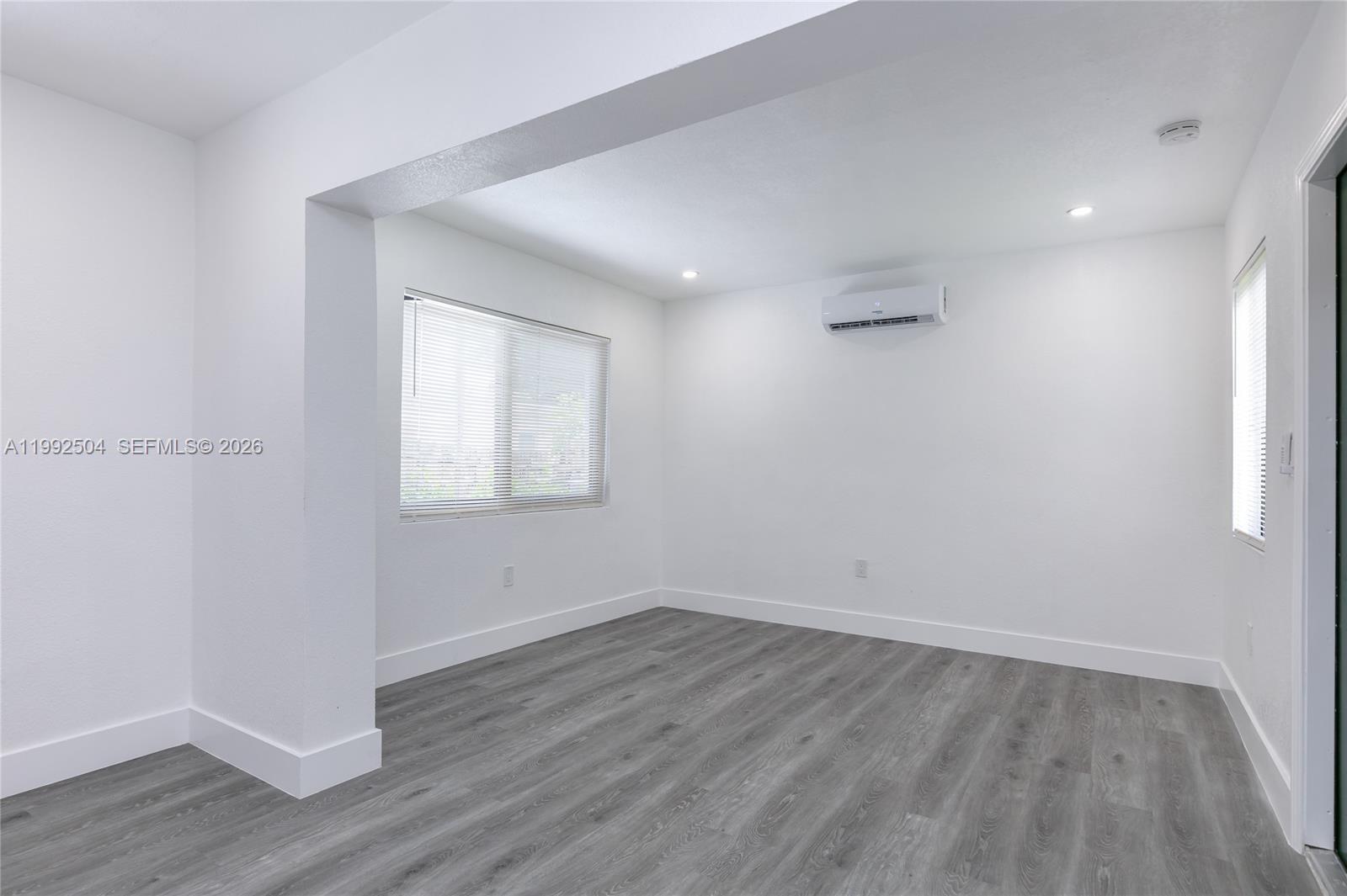 6125 Southwest 40th Court Miramar, FL 33023 - Photo 36 of 43 wooden floor in an empty room with a window