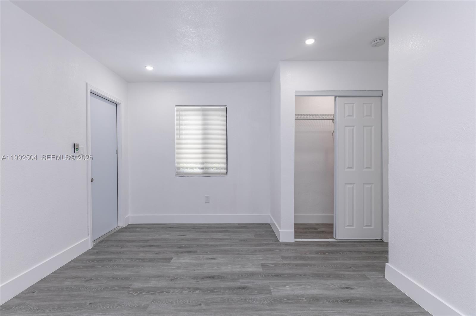 6125 Southwest 40th Court Miramar, FL 33023 - Photo 42 of 43 a view of an empty room with wooden floor and closet
