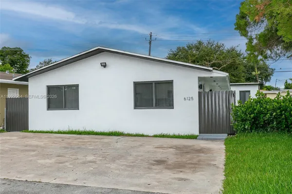 a front view of a house with garage