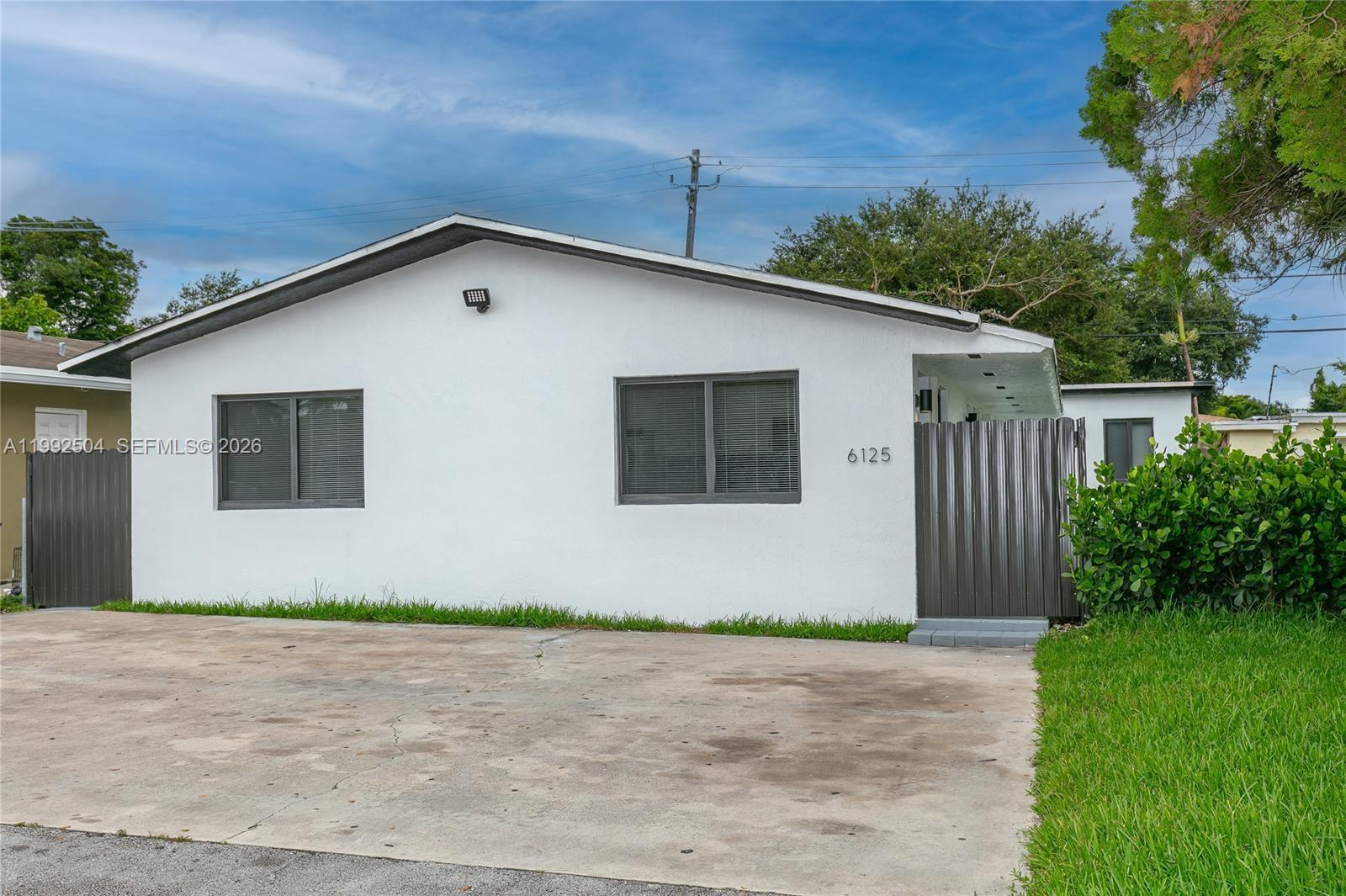 6125 Southwest 40th Court Miramar, FL 33023 - Photo 43 of 43 a front view of a house with garage