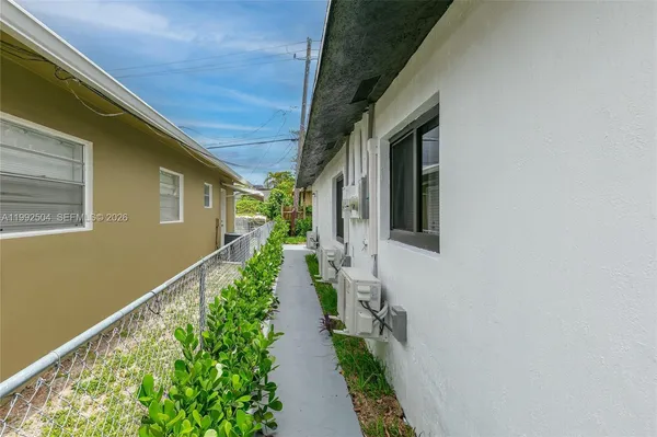 a view of a pathway with a house