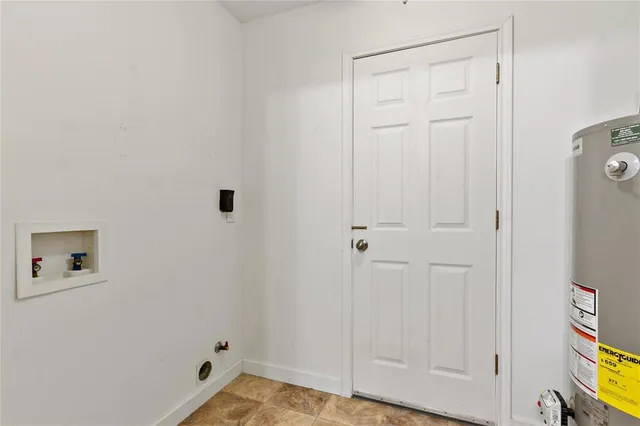 a living room with a couch and a dresser