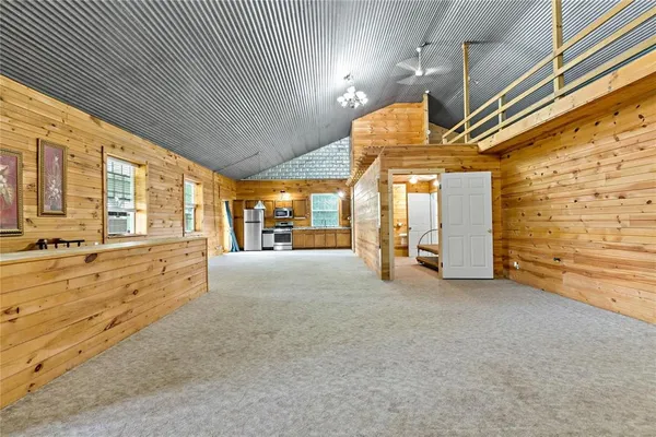 a view of an empty room with a fireplace