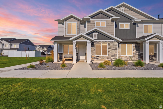 2216 South 1150 West Nibley, UT 84321 - Photo 1 of 34 Contemporary townhome exterior featuring multi-toned siding and stone accents