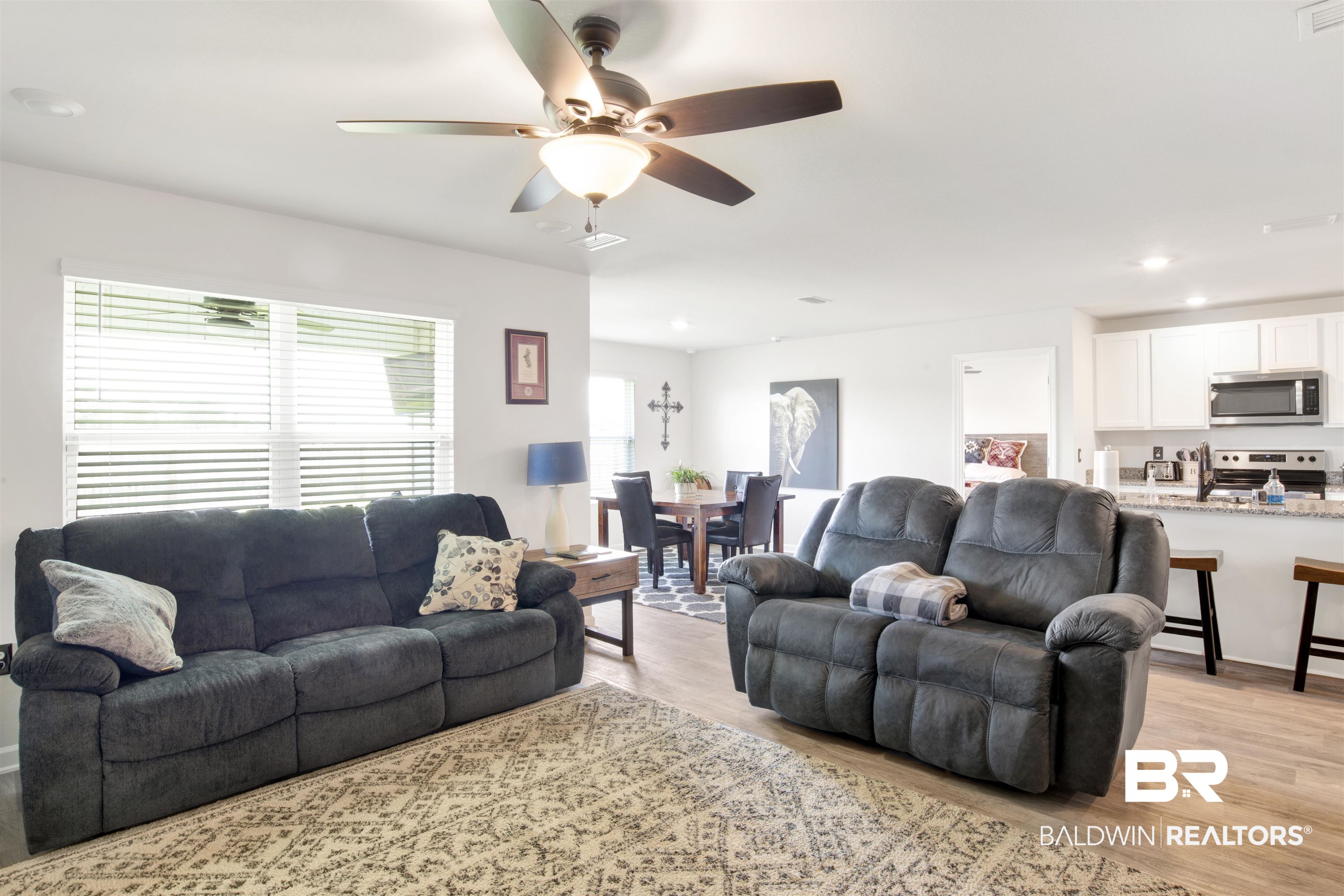 14731 Forsythia Loop Silverhill, AL 36576 - Photo 9 of 25 Living room with ceiling fan and light hardwood / wood-style floors
