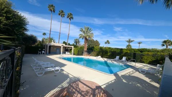 a view of a swimming pool with a patio