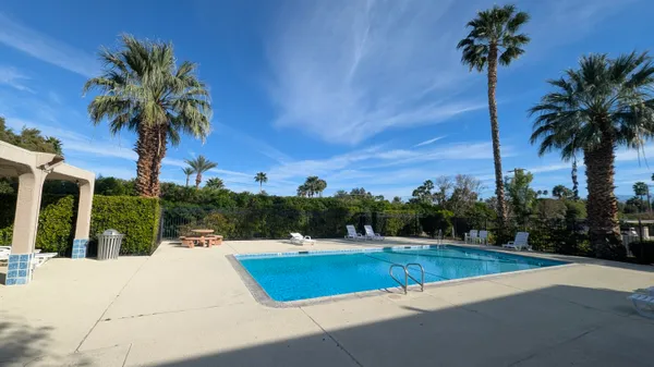 a view of swimming pool with a yard