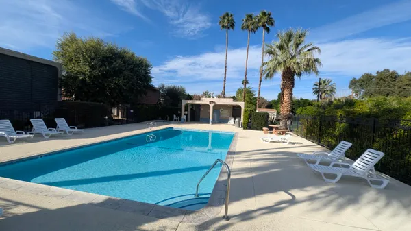 a view of a swimming pool with a patio