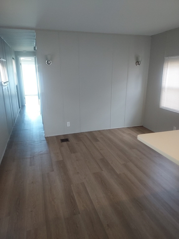 17 Lisa Drive Taunton, MA 02780 - Photo 10 of 21 a view of an empty room with wooden floor and a window