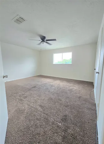 a bathroom with a double vanity sink and a toilet