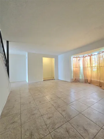 a view of entryway and hall with a window