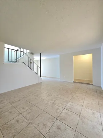 a kitchen with a sink a stove and cabinets