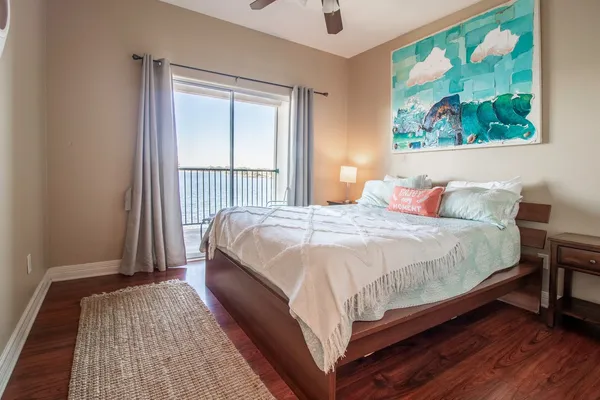 a bed sitting in a bedroom next to a window