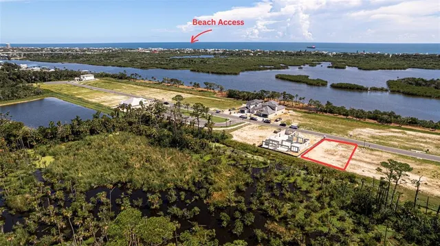 an aerial view of a city with lake view